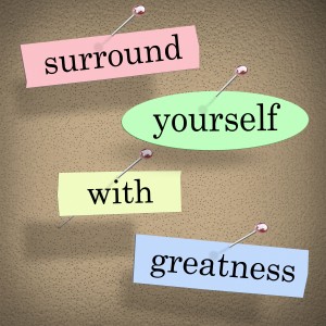 Surround Yourself with Greatness words in a saying or quote pin in the workplace.