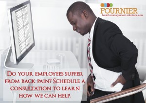 An employee pauses in his work from back pain.