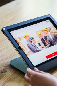 Person viewing safety training materials on a tablet